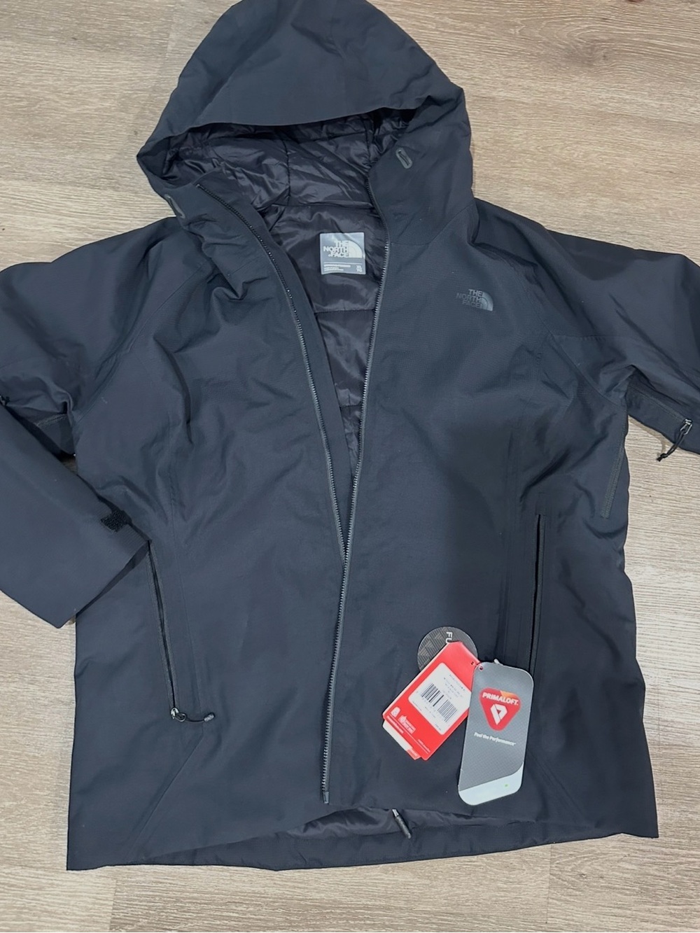 The North Face women’s Black Hooded Raincoat